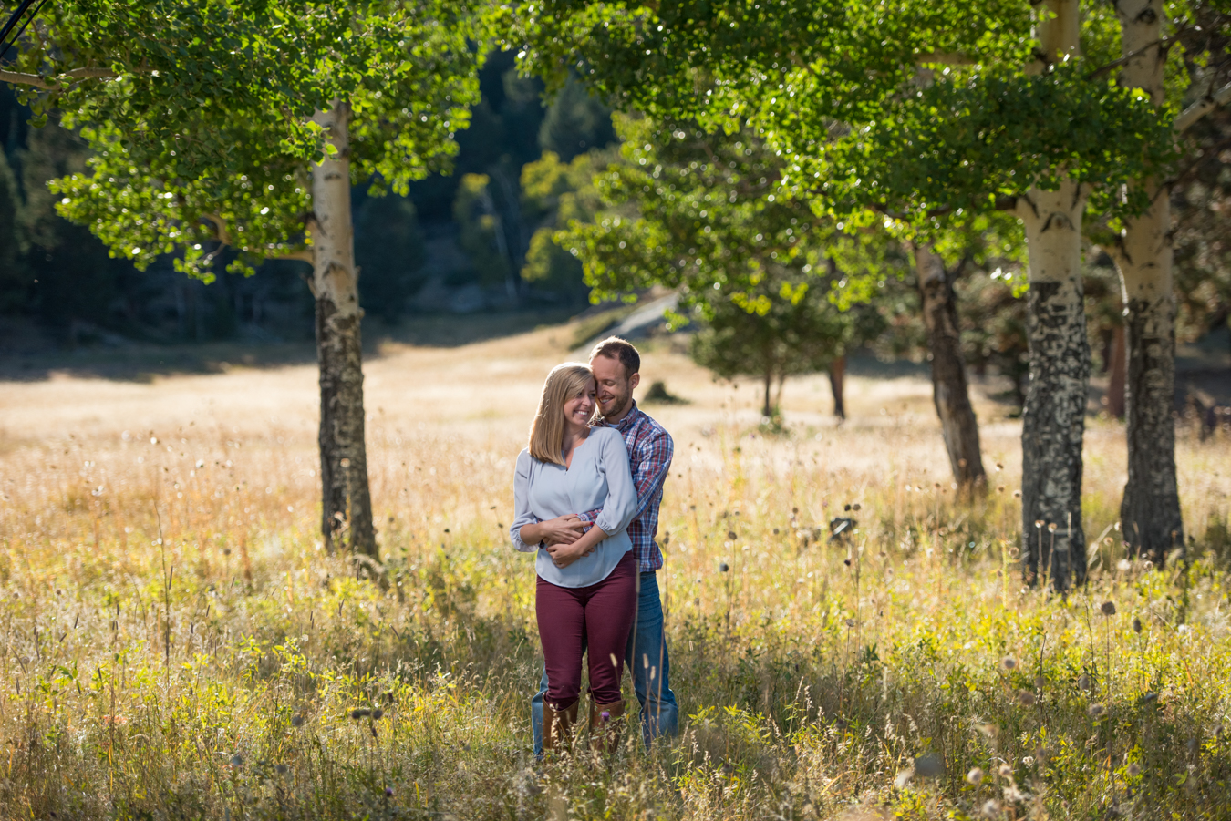 Rocky Mountain National Park Fall Engagement Cuddle in Aspen Trees