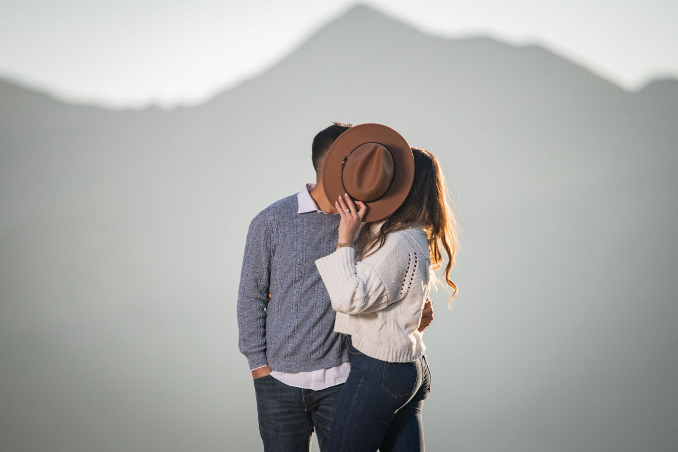 Sapphire Point Fall Engagement Hat Blocking Kiss | Colorado Wedding ...