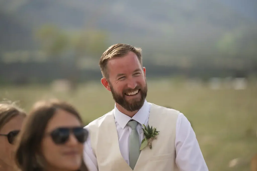 The Barn at Sunset Ranch Wedding Candid Groomsman