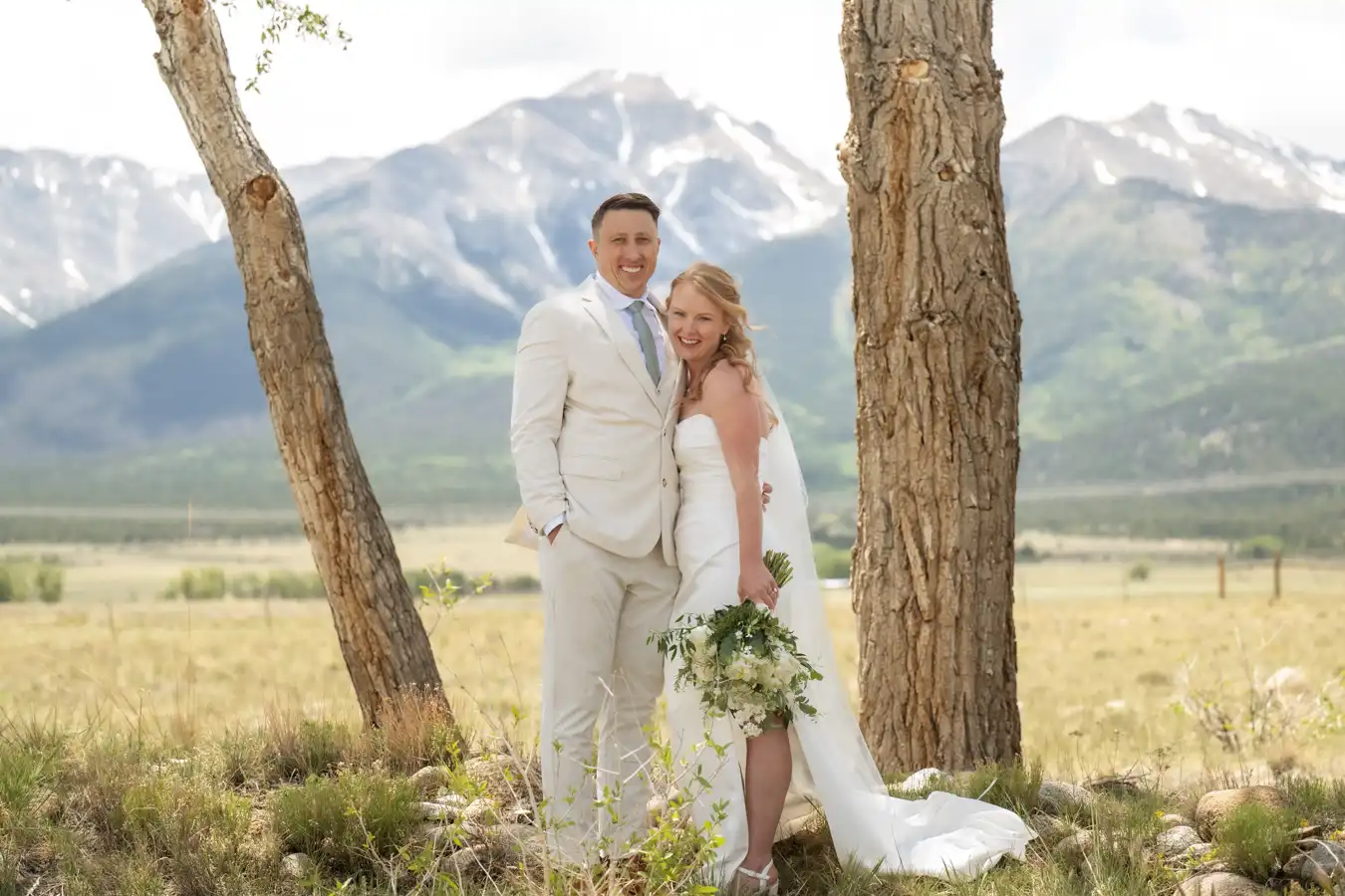 The Barn at Sunset Ranch Wedding Couple Between Trees