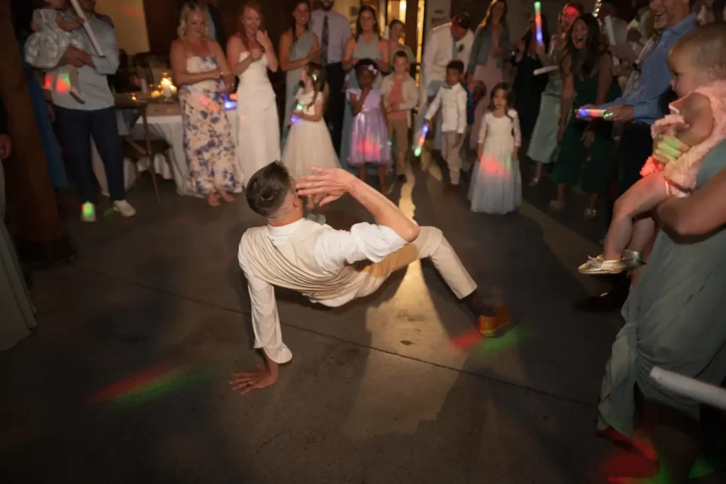 The Barn at Sunset Ranch Wedding Groomsman Dancing