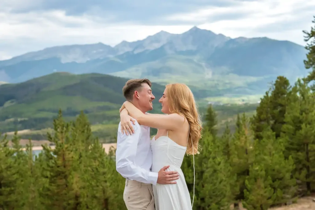 Sapphire Point July Engagement White Dress Arms Around Him